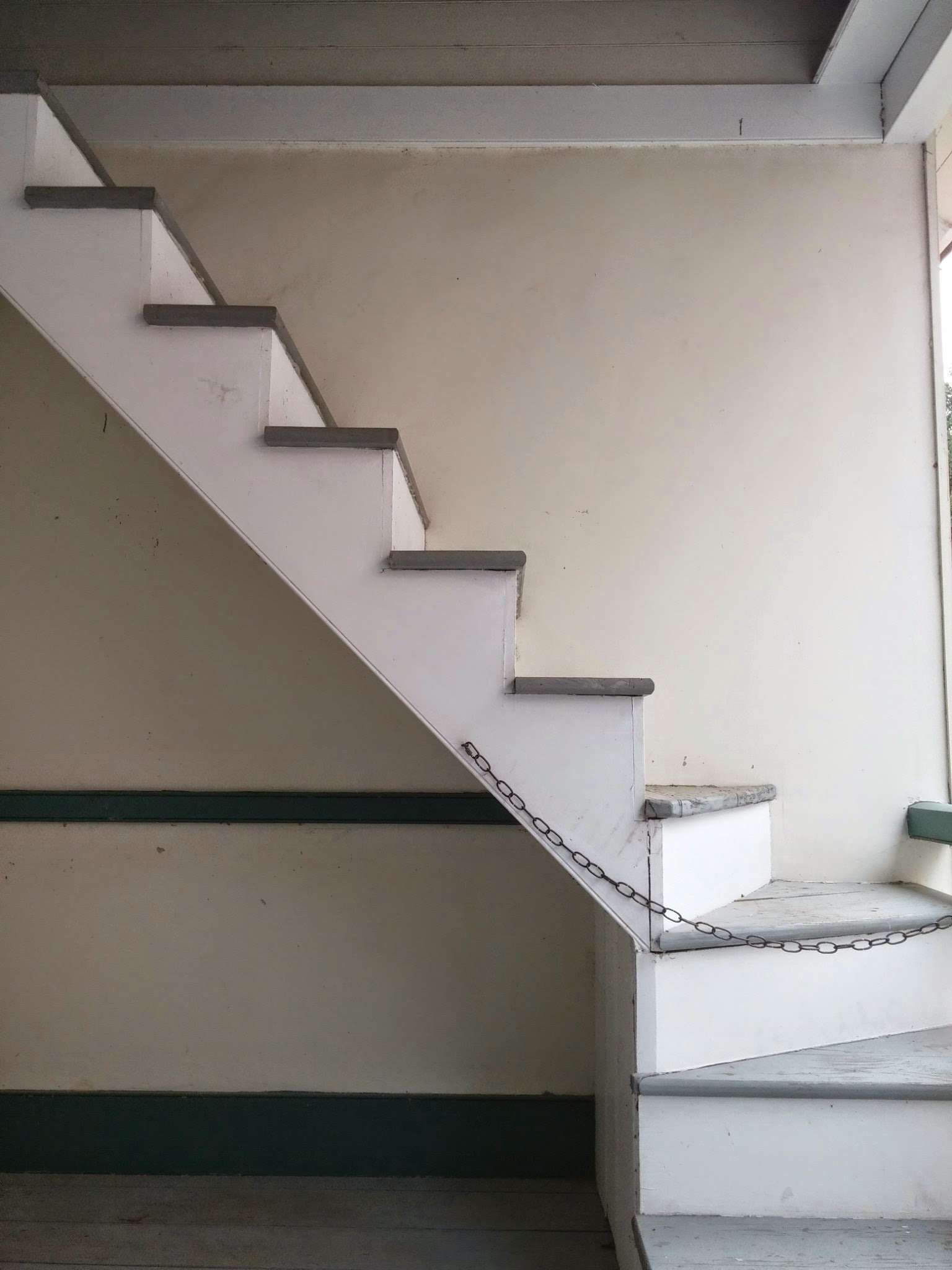 A staircase rising to the loft